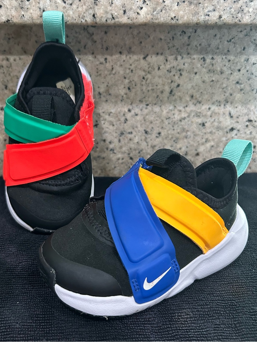 Nike Kids Black Sneakers with Blue, Yellow & Red Straps